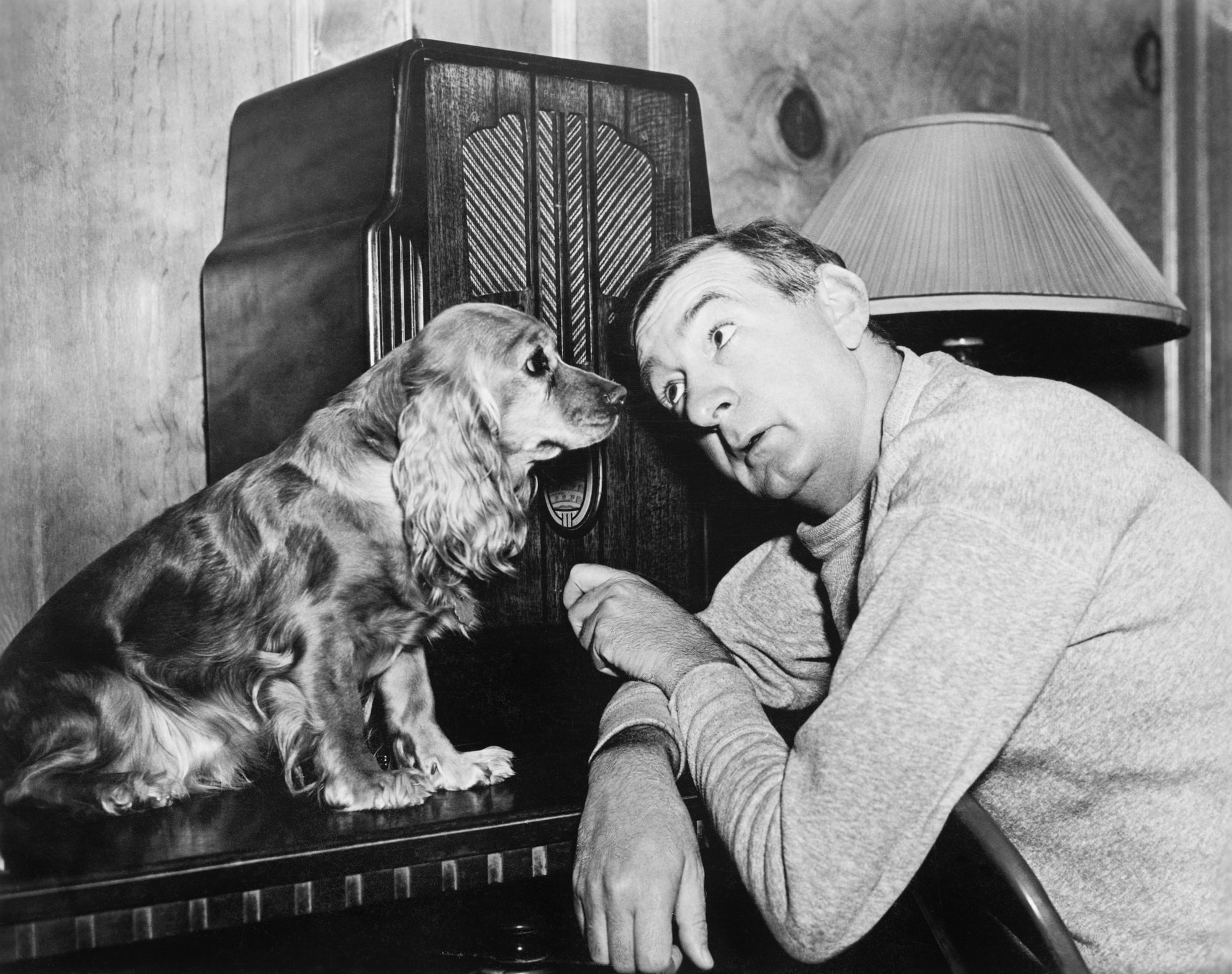 Man listening to radio with dog